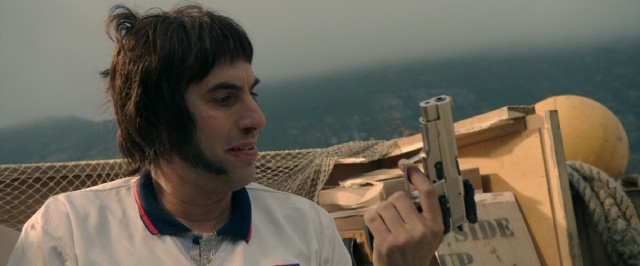 Nobby (Sacha Baron Cohen) quickly develops a fondness for guns, which he uses to dispense anyone and anything in his path.