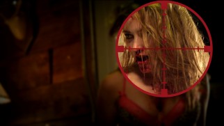 A zombie girl (Meg Cionni) gets in the crosshairs of the Blu-ray's main menu.