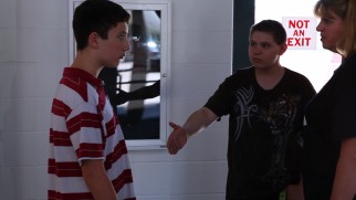 A victim is reluctant to heed the principal's advice, shake hands and forgive his recurring bully.