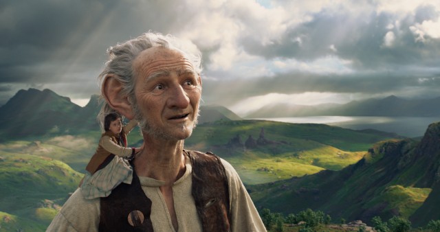 Sophie (Ruby Barnhill) catches a ride on the shoulder of the Big Friendly Giant (Mark Rylance) in "The BFG"