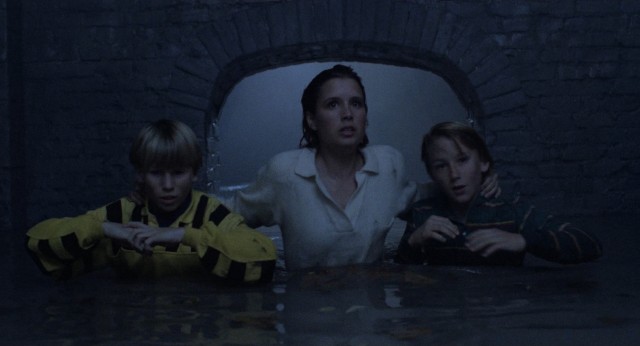 On a night that began with a date and death, Meg Penny (Shawnee Smith) winds up in a sewer with her younger brother (Michael Kenworthy) and his friend (Douglas Emerson), hoping they can stay alive.