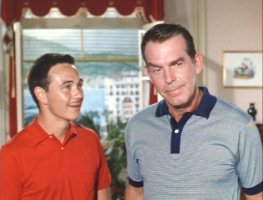 A mustachioed Tommy Kirk with Fred Macmurray