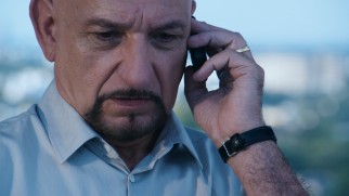 Can you hear me now? Ben Kingsley eludes authorities by using a rotation of cell phones and SIM Cards from the rooftop of a Colombo, Sri Lanka building.