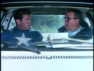 Steve Rogers (Matt Salinger) accepts an opportune ride to safety from Washington journalist Sam Kolawetz, but he can only take so much Ned Beatty.
