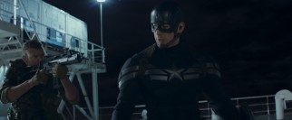 Captain America (Chris Evans) takes a hijacked ship by storm in the film's dynamic opening action sequence.