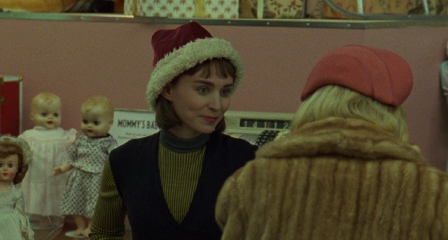 In "Carol", a New York department store's toy counter clerk (Rooney Mara) helps a woman (Cate Blanchett) buy a Christmas present for her daughter.