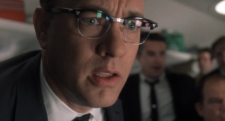 Carl Hanratty (Tom Hanks) looks on with disbelief as his target eludes his grips once more.