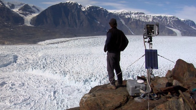 James Balog takes in the view of a melting glacier from one of his newly-installed programmed cameras in "Chasing Ice."