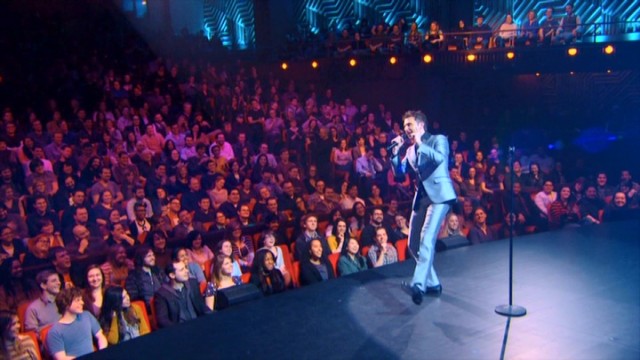 Chris Hardwick entertains a small, pink-tinted, non-paying audience of 800 at NYU's Skirball Center in his Comedy Central special "Mandroid."