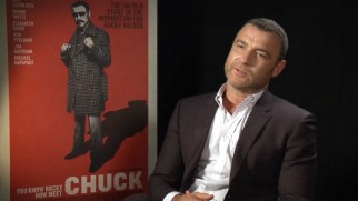 In "All About 'Chuck'", a cleaner-shaven Liev Schreiber speaks next to the poster of the film he wrote, produced and stars in.