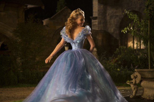 Cinderella (Lily James) admires the dress her fairy godmother has made over for her in Disney's 2015 live-action "Cinderella."