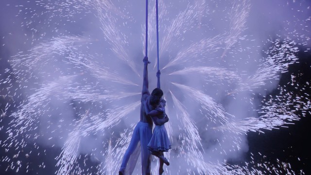 Pinwheel fireworks serve as a dynamic backdrop to The Aerialist and Mia's inevitable happy ending.