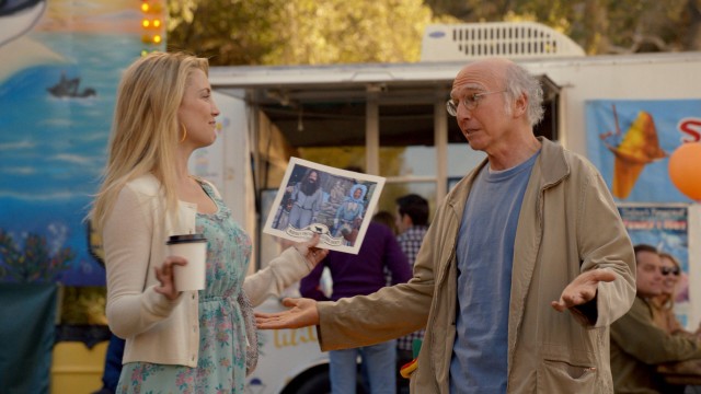 Rolly (Larry David) picks up vibes from Rhonda (Kate Hudson) on their shared day at the fair.