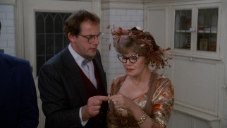 Professor Plum (Christopher Lloyd) and Mrs. Peacock (Eileen Brennan) draw matching matches, meaning they'll explore part of the mansion together.