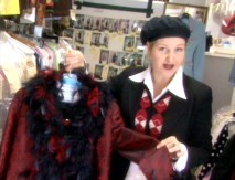 Costume designer Mona May shows off one of Cher Horowitz's more than fifty featured costumes in "Fashion 101".