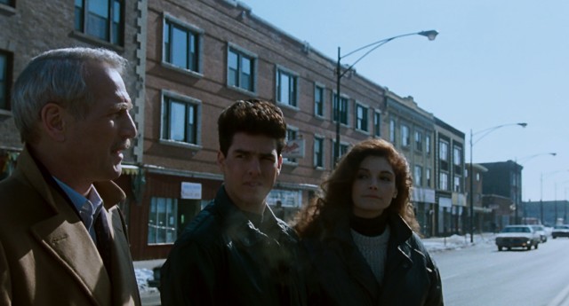 For a 60% cut of their winnings, Fast Eddie Felson (Paul Newman) shares some of his hustling wisdom with young couple Vincent Lauria (Tom Cruise) and Carmen (Mary Elizabeth Mastrantonio) on a chilly road trip.