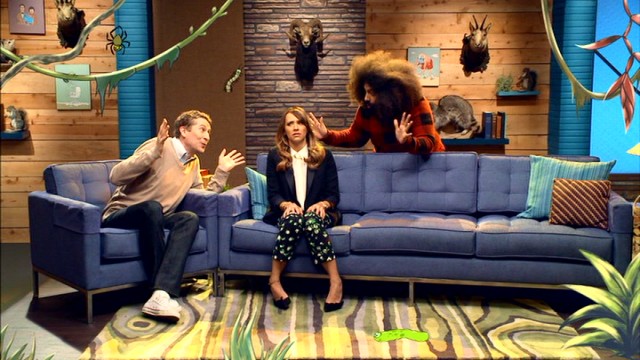 With help from animation, Scott Aukerman and Reggie Watts encourage Rashida Jones to try eating a bug in a Season 2 "Comedy Bang! Bang!" episode.