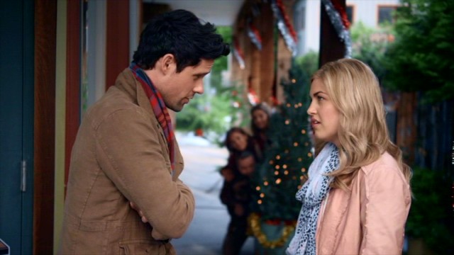 With her family not so stealthily looking on, Kate O'Brien (Carly McKillip) tries to patch things up with Mike the woodworker (Ben Hollingsworth) in  "Coming Home for Christmas."