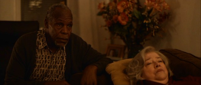 Danny Glover and Kathy Bates chip in some veteran support as a dry joke-making Haitian and his injured wife.