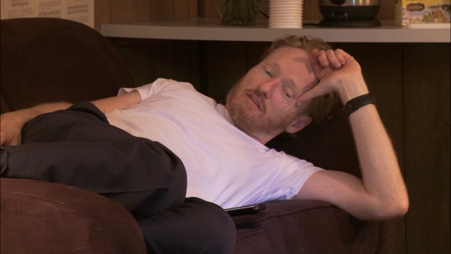 Conan O'Brien's inability to stop catches up with him at the Bonnarroo Music Festival where he has to introduce musicians.