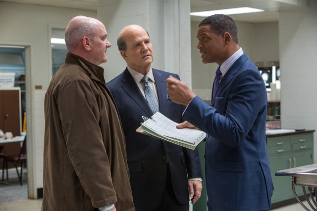 Dr. Bennet Omalu (Will Smith) defends the non-standard tests he orders as part of a former NFL player's autopsy to his mentor (Albert Brooks) and his adversary (Mike O'Malley).