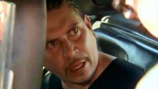 This cornrowed man disputes his wife's account of their domestic incident.