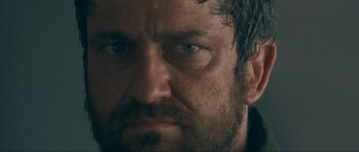 Coriolanus' blood enemy Tullus Aufidius (Gerard Butler) shoots him a menacing look before their one-on-one knife fight begins.