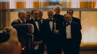 Surrounded by alumni of The Corman Film School and honorary graduate Quentin Tarantino, Roger Corman proudly holds his lifetime achievement Oscar.