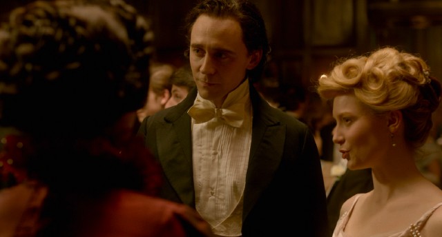 Thomas Sharpe (Tom Hiddleston) and Edith Cushing (Mia Wasikowska) attend a ball together in "Crimson Peak."