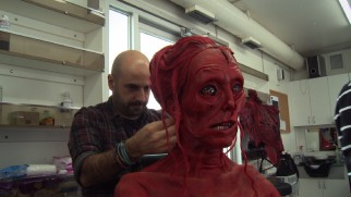 "Crimson Phantoms" shows us that the film's red ghosts are real actors in extreme prosthetics.
