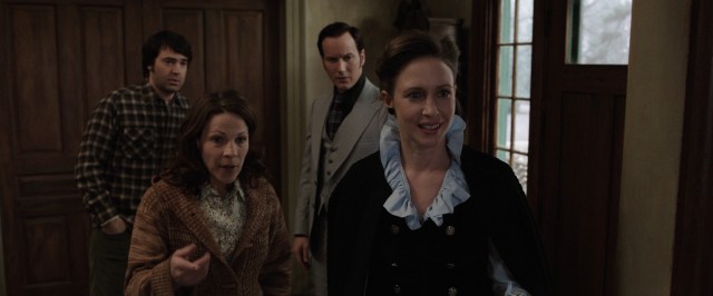 Carolyn Perron (Lili Taylor) introduces Lorraine Warren (Vera Farmiga) to her five daughters in "The Conjuring."