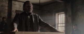 Reliable character actor Stephen Root makes a brief but memorable appearance as dubious prosecution witness John Lloyd.