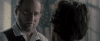 Kevin Kline sports a beard with no mustache to portray unsympathetic Secretary of War Edwin Stanton.