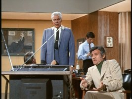 A.J. Arno and henchman are after the computer boy.