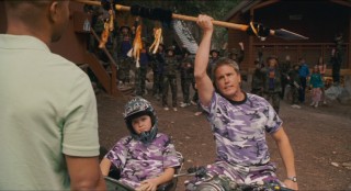 Camp Canola's head (Lochlyn Munro) and his young, coordinated charge (Sean Patrick Flaherty) try their intimidation tactics in lavender camouflage.