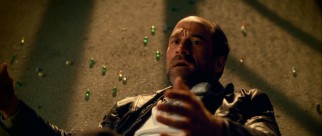 Creepy undercover cop Chuck Dooney (Elias Koteas) falls victim to the first line of Defendor weaponry: marbles.