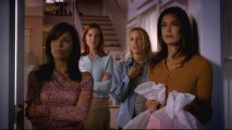 The four central housewives peer out onto their home street, Wisteria Lane.