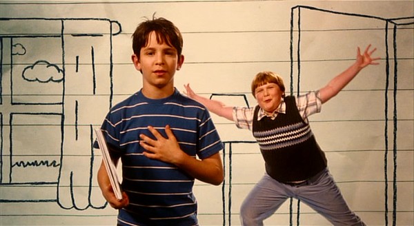 Best friend Rowley Jefferson (Robert Capron) pops out with a Zoo-Wee-Mama while Greg Heffley (Zachary Gordon) delivers his closing address.