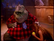 Stood up by his boss, Earl is comforted by the family's briefly-owned pet "caveman" Sparky.