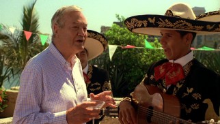 Dr. Frank Reeves (legendary B-movie producer Roger Corman) enjoys the mariachi band, but not the volume at which they're playing for the marina fiesta.