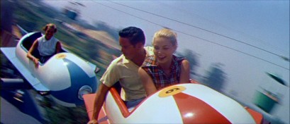This sporty young couple of the 1950s flies high in the Astro-Jets of Tomorrowland (the Astro Orbiter today) in "People and Places: Disneyland U.S.A."