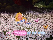 Alice sings "In A World Of My Own" while reclining in a bed of daisies.