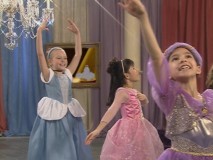 All dressed up, the girls strut their stuff for a flimsy pop song Dance Along.