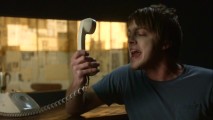 Minneapolis-based rock band This World Fair scream-sings into the telephone in their included music video "Don't Make Me Wait."