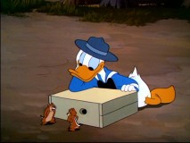 Donald is entertained by the argument ensuing between Chip and Dale in "Winter Storage."