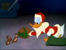 Chip eagerly accepts Donald Claus gift, not knowing whats really inside.