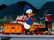 Donald Duck looks like his boss here, displaying Walt Disney's own love for model trains in "Out of Scale."