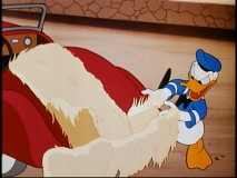 Donald's efforts to retouch his car are foiled by a pesky bird in "Wet Paint."