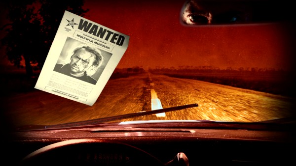 A wanted sign for Milton in the state of Louisiana hits the windshield of a car, whose rearview mirror reflection reveals is clearly driven by the Nicolas Cage character in the first-person dashboard view of the Blu-ray menu adapted from the film's closing credits.