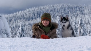 Adam smiles with his trusty husky Shasta (voiced by "Suite Life of Zack & Cody" star Dylan Sprouse) by his side.